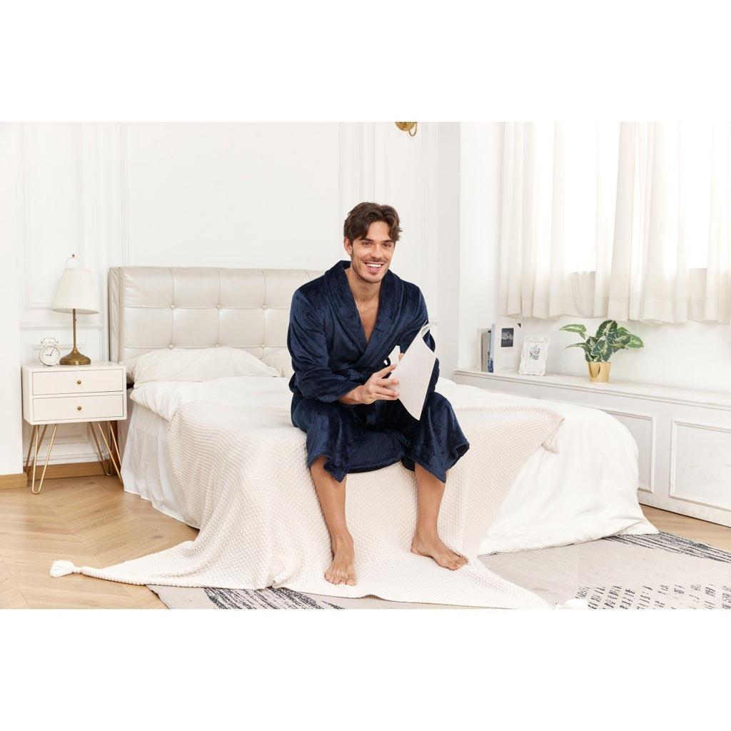Man sitting on bed wearing Men's Plush Long Robe Soft And Warm Bathrobe, enjoying a cozy moment at home.