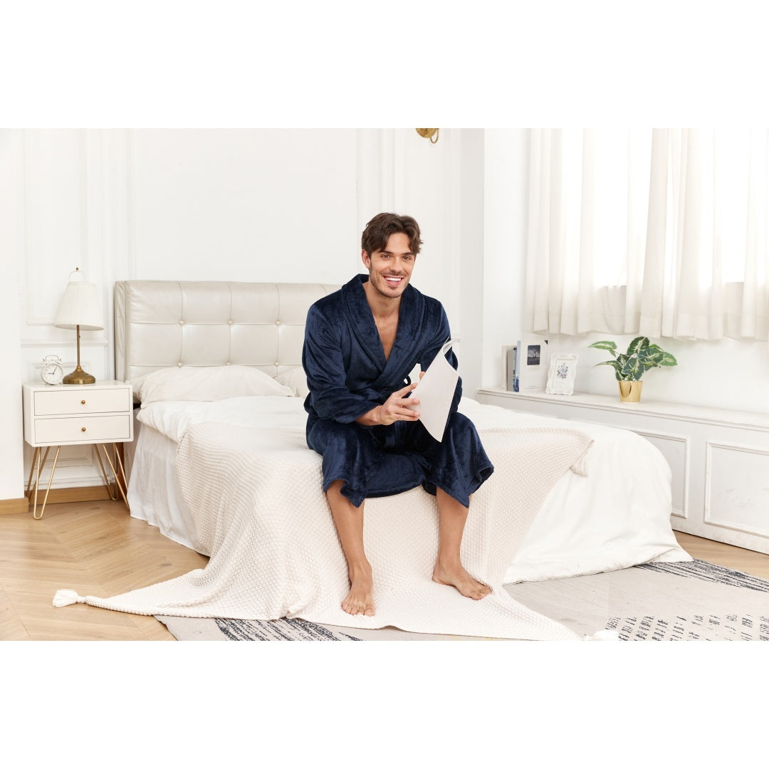 Man sitting on bed wearing Men's Plush Long Robe Soft And Warm Bathrobe, enjoying a cozy moment at home.