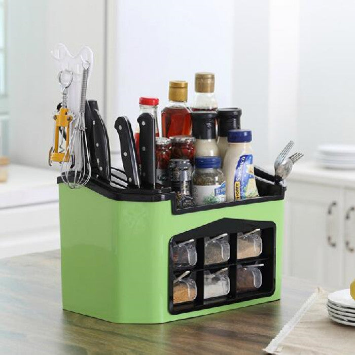 Organized kitchen supplies in a green container from Douyin The Same Household Kitchen, featuring utensils and sauces.
