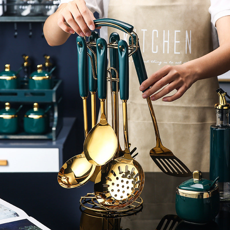 7 PCS Stainless Steel Silicone Kitchen Utensil Slotted set displayed on a countertop with elegant gold and green design.
