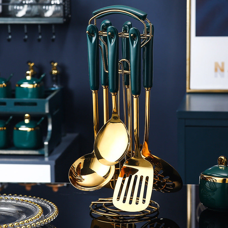 7 PCS Stainless Steel Silicone Kitchen Utensil Slotted set displayed on a holder with elegant gold and green design.