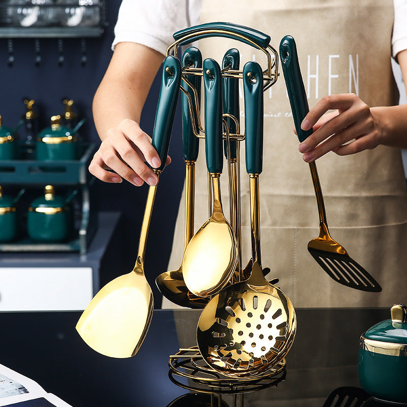 7 PCS Stainless Steel Silicone Kitchen Utensil Slotted set in stylish display with gold and teal utensils.