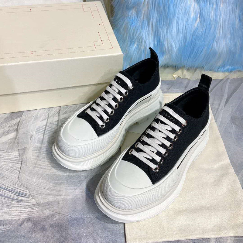 Women Shoe High Low Sole Black stylish footwear with black upper and white sole, perfect for any occasion.