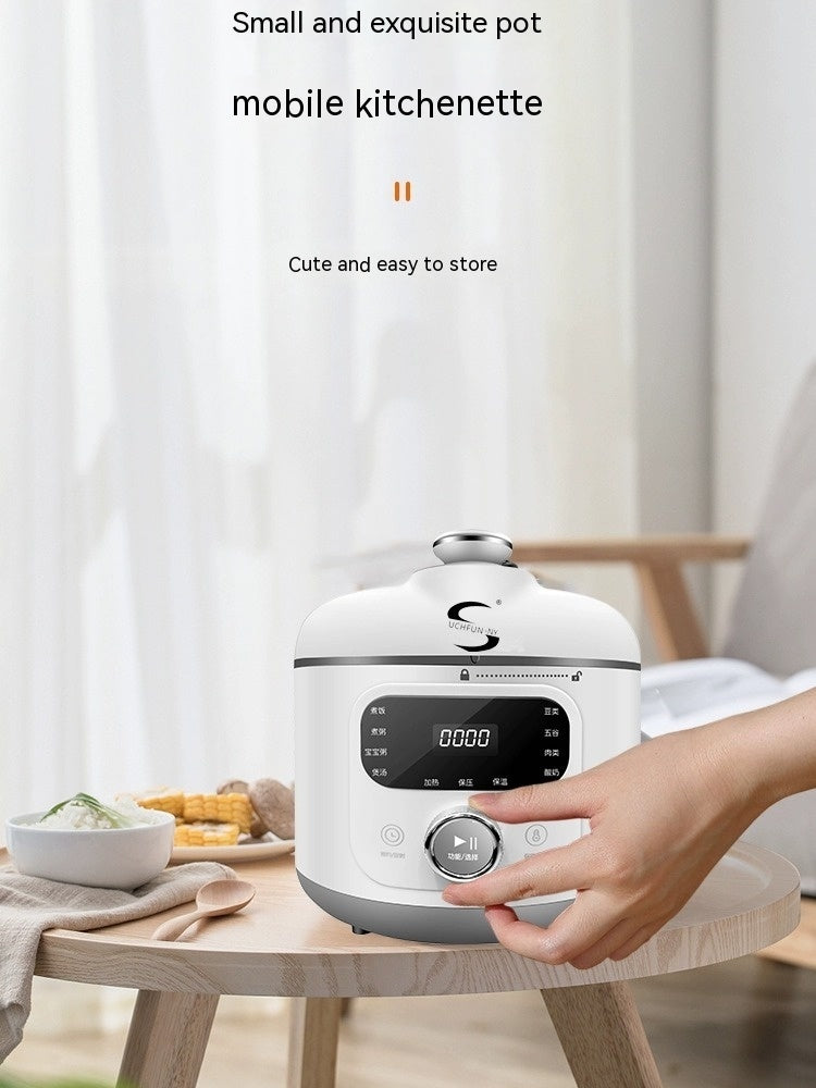 Electric Pressure Cooker Small Household Appliances on a kitchen table with a hand reaching for it.