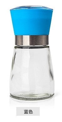 Creative kitchen appliances hand glass grinder with a blue lid and transparent glass body.