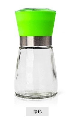 Creative kitchen appliances hand glass grinder with a green top, perfect for seasoning and enhancing your culinary creations.