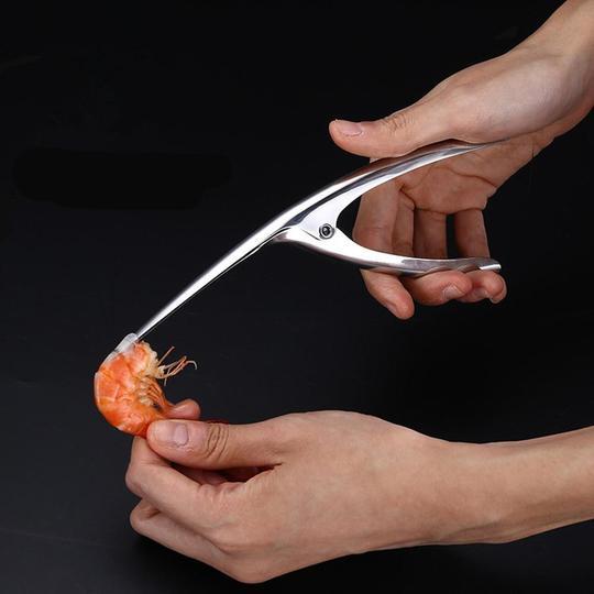 Shrimp Peeler Kitchen Appliances in use, designed for easy and efficient shrimp peeling, showcasing the innovative tool.