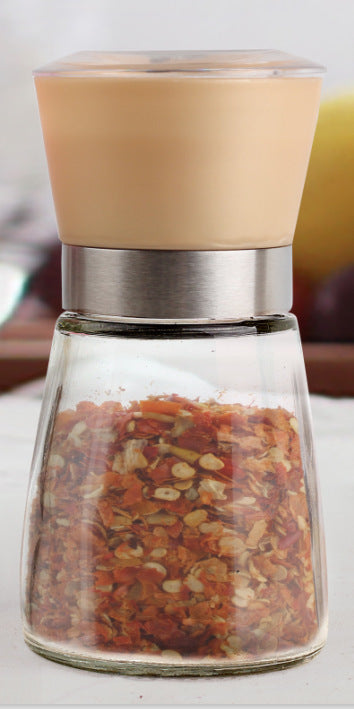 Creative kitchen appliances hand glass grinder showcasing a stylish design and spices inside.