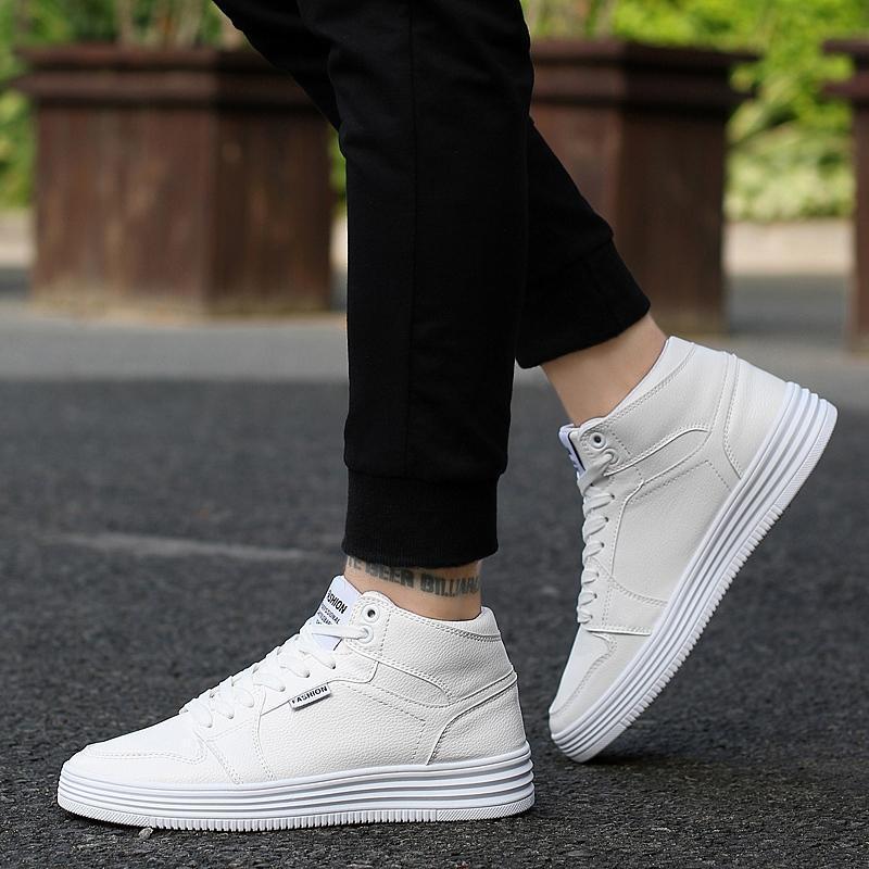 Round Head High-Top Strap Flat White Shoes Men worn by a person outdoors, showcasing a stylish and versatile design.