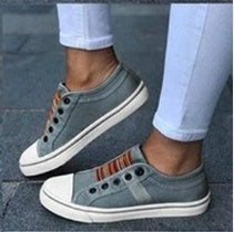 Round head stretch canvas shoe worn with white pants, showcasing casual style and comfort.