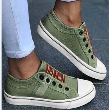 Round head stretch canvas shoe in green with striped design, perfect for casual comfort and style.