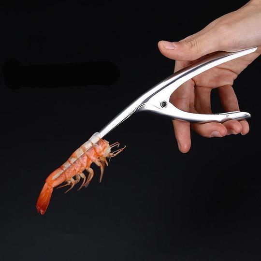 Shrimp Peeler Kitchen Appliances in use, showcasing efficient shrimp peeling with a hand-held tool.