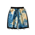 Summer New Tie-Dye Shorts Men S Drawstring Loose in blue and yellow color with elastic waistband and side pockets.