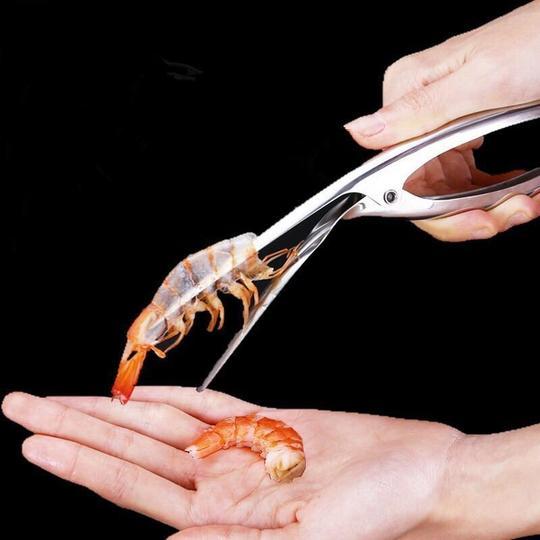 Person using Shrimp Peeler Kitchen Appliances to remove shrimp shells effortlessly.