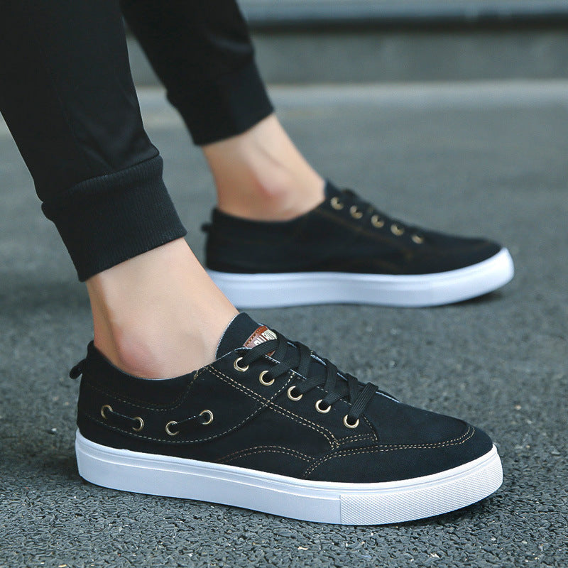 Breathable casual lazy canvas shoes displayed on a person's feet, showcasing a stylish black design and comfortable fit.