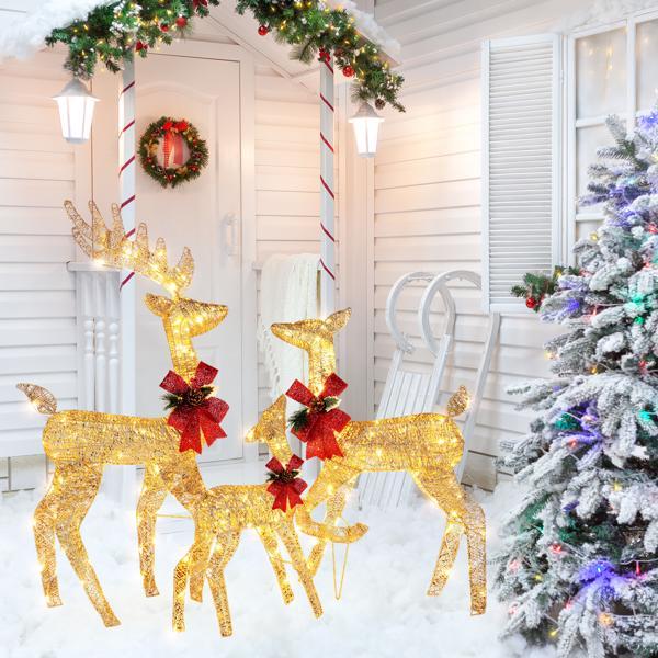 Golden Elk Family Courtyard Elk Decoration displayed in a snowy Christmas courtyard setting.