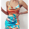 Women's Sexy Backless Suspender Skirt Dresses featuring a vibrant tie-dye design and flattering silhouette.