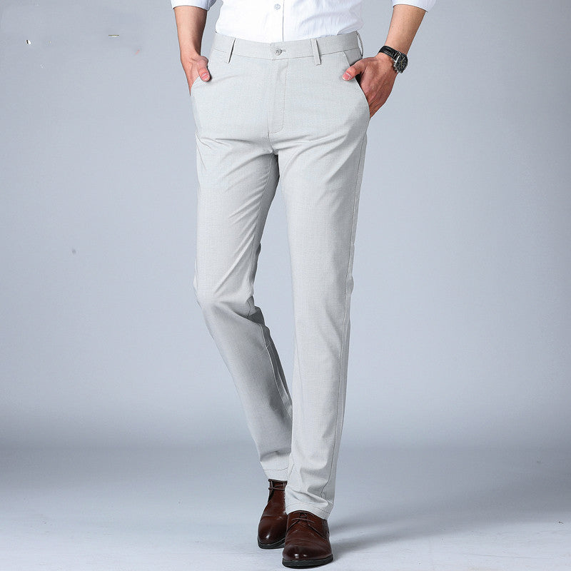 Woodpecker Thin Men's Pants Summer Non Ironing displayed on a man in a stylish pose, featuring a lightweight and breathable design.