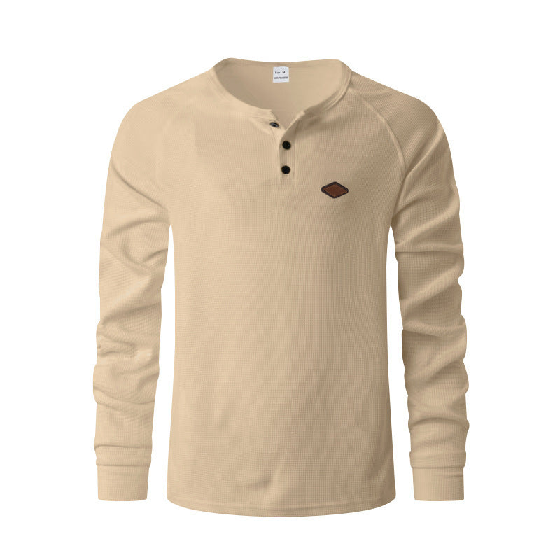 Quick-drying Raglan Henry Long Sleeve in beige with a Henley neckline and a small logo.