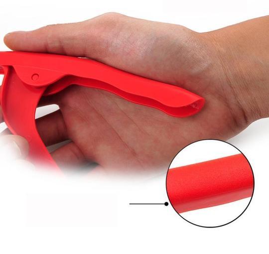 Shrimp Peeler Kitchen Appliances grip detail shown in a hand, showcasing ergonomic design and easy handling.