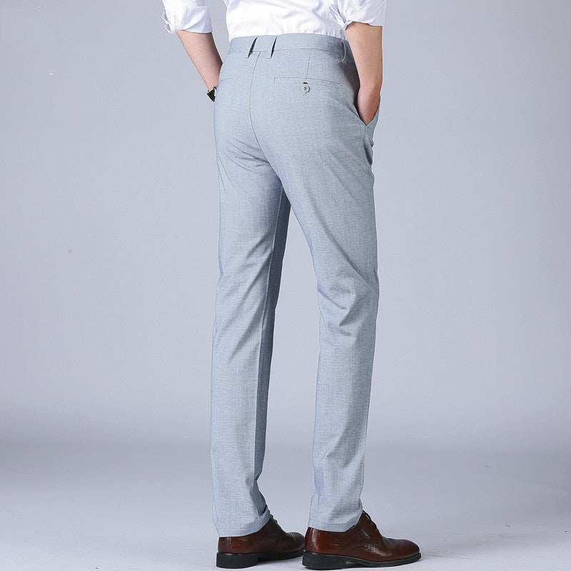 Model showcasing Woodpecker Thin Men's Pants Summer Non Ironing from the back, highlighting the light fabric and sleek design.