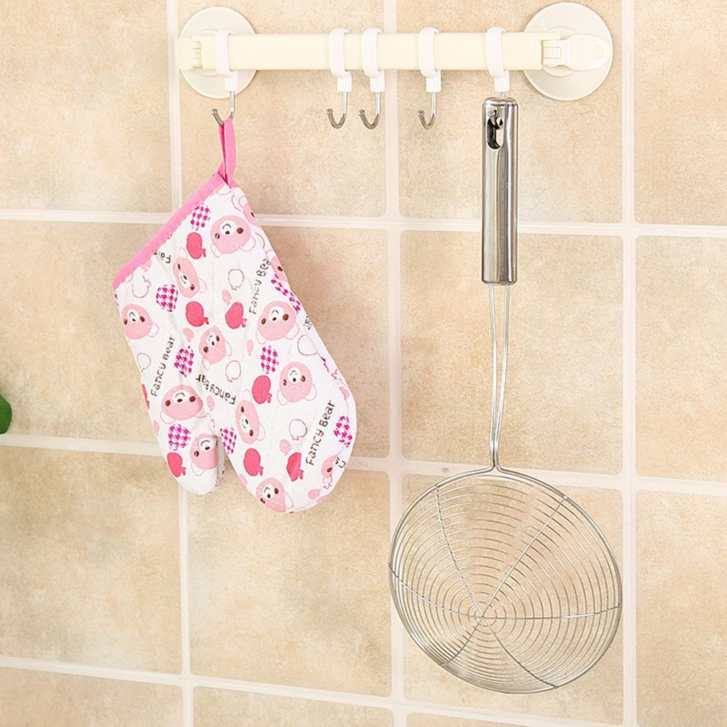 Kitchen Cooking Utensils Net Drain hanging with pink oven mitt on a wall hook, ideal for cooking and straining.