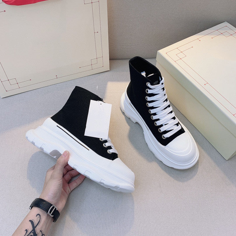Women Shoe High Low Sole Black stylish high-top sneaker with contrasting white sole and laces, perfect for modern fashion.