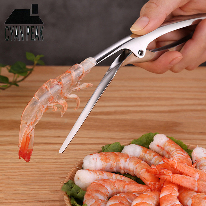 Shrimp Peeler Kitchen Appliances used to easily peel shrimp, showcased with shrimp on a wooden board.