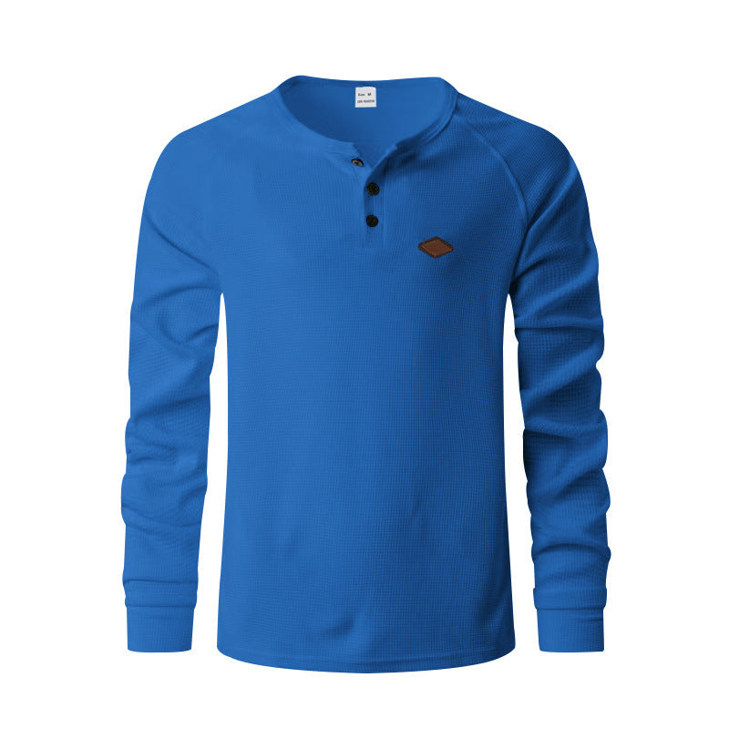 Quick-drying Raglan Henry Long Sleeve in blue with button details and logo.