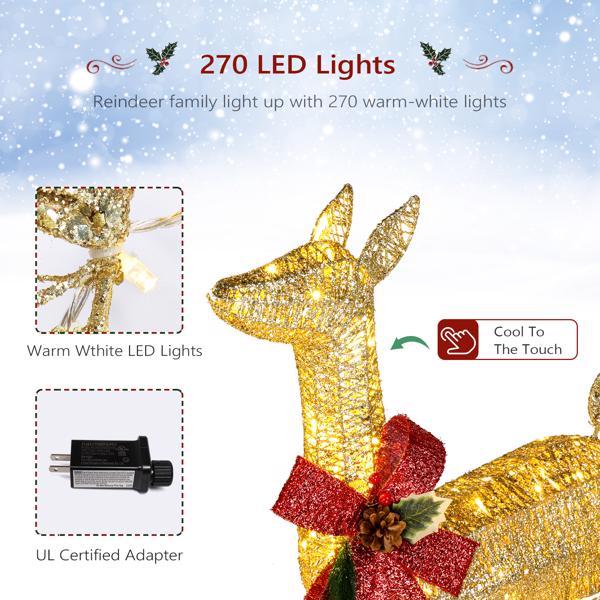 Golden Elk Family Courtyard Elk Decoration with warm white LED lights and a festive bow in a snowy background.