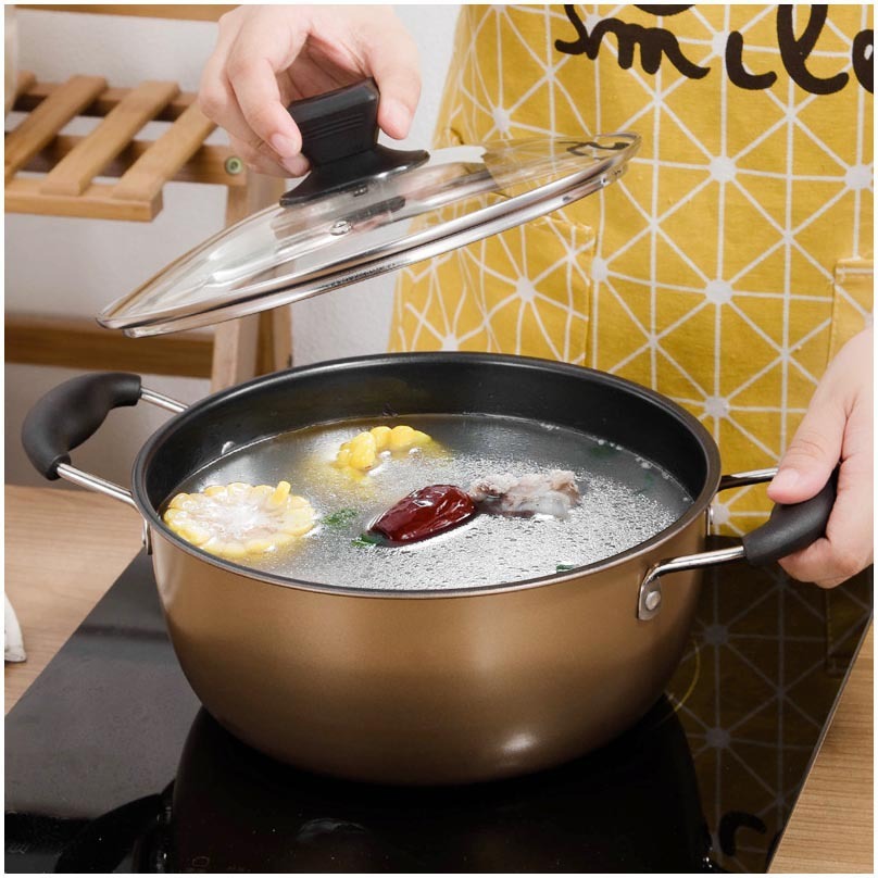Set Of Pot Kitchen Cookware Cooking Pots with lid on, boiling ingredients on the stove for perfect cooking.