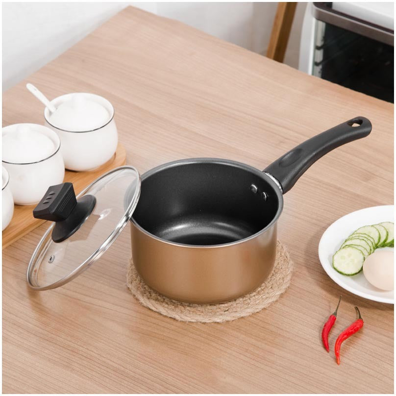 Set Of Pot Kitchen Cookware Cooking Pots on a wooden table with lid, ideal for versatile cooking and elegant kitchen style.