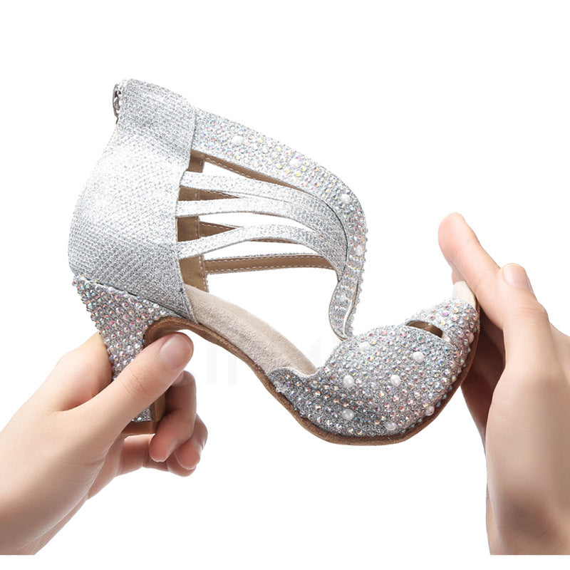 Diamond-encrusted Senior Dance Shoe Women with sparkling upper held in hand, perfect for ballroom dancing.