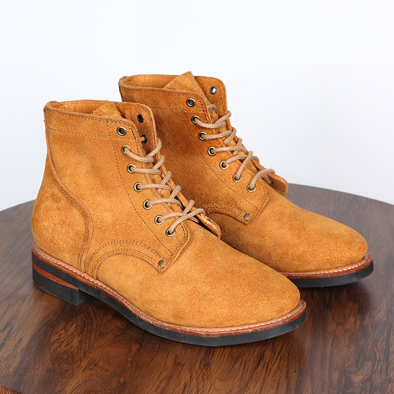Vintage Work Boots High Top shoe in tan suede displayed on a wooden surface.